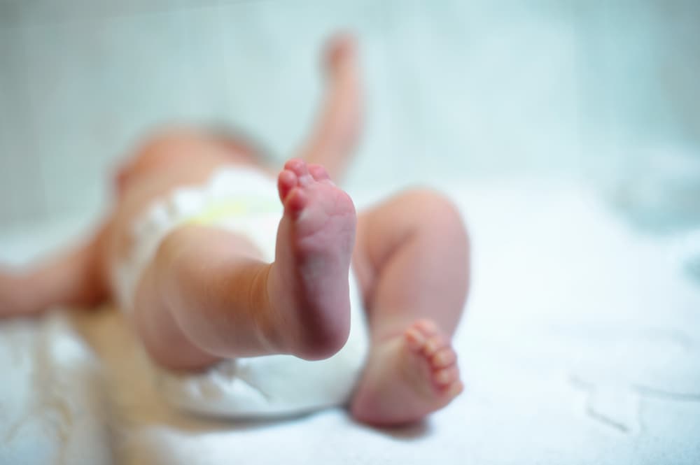 gentle baby feet baby. newborn child