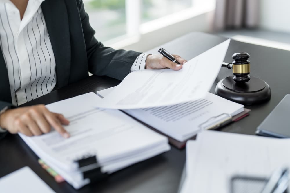 Lawyer working with lawbook in office or courtroom Legal counsel with gavel and legal law.